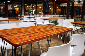 Table in a summer cafe after the rain. Raindrops on the table.