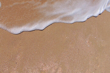 beach, white foam on yellow sand, transparent wave, summer vacation