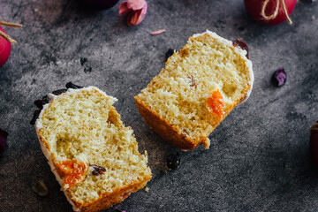 Easter cake. A traditional Orthodox dish for Easter. Easter cake with dried apricots, raisins and icing. Easter composition with painted eggs 