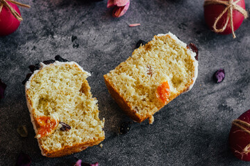 Easter cake. A traditional Orthodox dish for Easter. Easter cake with dried apricots, raisins and icing. Easter composition with painted eggs 