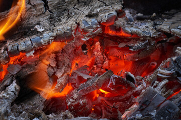 Close up view of the embers in a campfire or fireplace.