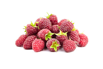 Raspberries with green leaves isolated on white background. Heap of red raspberries, sweet summer berries