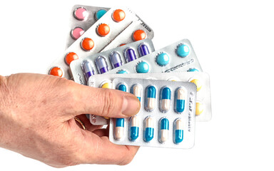 Drug prescription for treatment medication.Close-up of hand holding medication blister packs of...