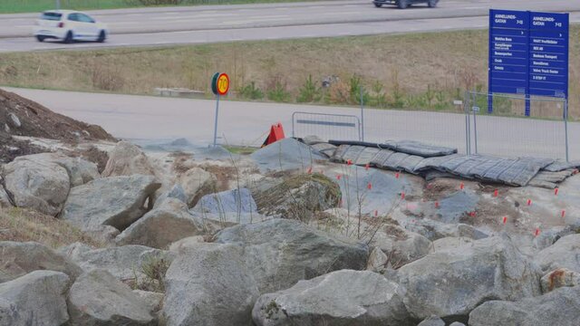 Close up view of construction imploding works on rocky terrain with sound warning. Enkoping. Sweden. 05.10.2021.