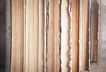 Old books on wooden background.