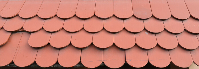 Red tiles roof close up of the house.