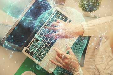 Double exposure of woman working on computer andhuman brain hologram drawing. Top View. Ai concept.