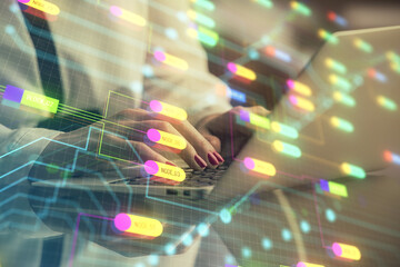 Multi exposure of woman hands working on computer and data theme hologram drawing. Tech concept.