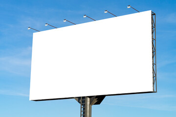 Blank big billboard against blue sky background. White horizontal board mock up for advertising, marketing, advert information