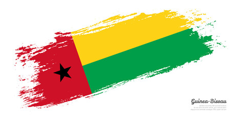 Obraz premium Hand painted brush flag of Guinea-Bissau country with stylish flag on white background