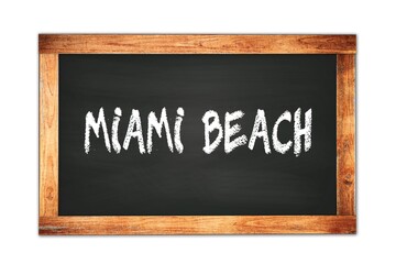Fototapeta premium MIAMI BEACH text written on wooden frame school blackboard.