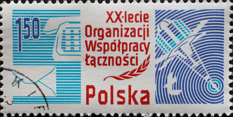  A post stamp printed in Poland showing a satellite and phone. The 20th Anniversary of the...