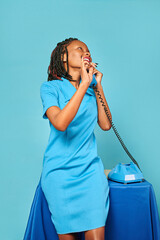 happy girl secretary african american emotionally talking on the phone