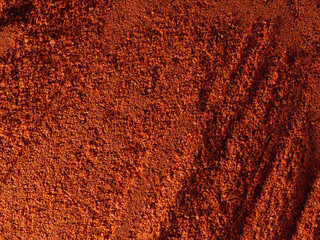 Red ground paprika, texture, top view.
