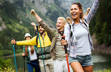 Hiking with friends is so fun. Group of young people with backpacks together