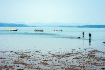 Boats anchored in Morecambe Bay, Lancashire, UK.
