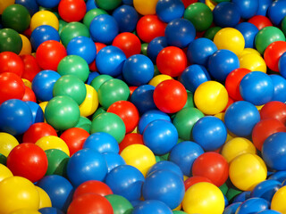many multicolored round plastic balls side view