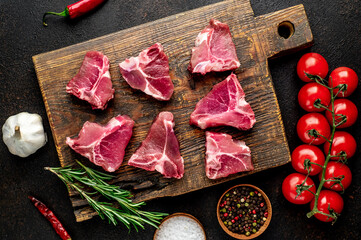 mini raw Beef T-Bone steak on stone background