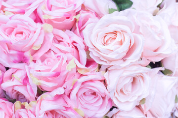 Close up of many fabric pale pink roses with blurred  background as Valentine’s day concept.
