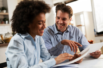 Husband and wife preparing bills to pay. Stressed woman and man having financial problems