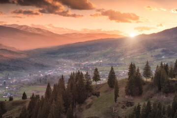 Naklejka na ściany i meble Alpine carpathian valley illuminated by sunset sun