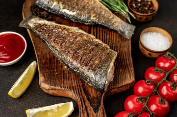 grilled sea bass with spices on a stone background