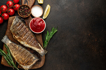 grilled sea bass with spices on a stone background