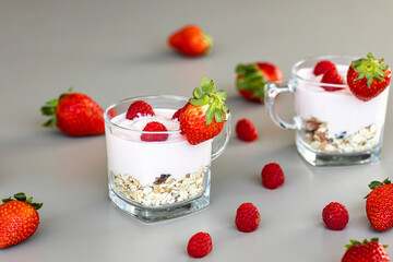 Delicious strawberry and raspberry yogurt with cereals