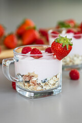 Delicious strawberry and raspberry yogurt with cereals