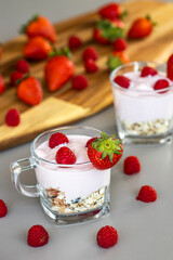 Delicious strawberry and raspberry yogurt with cereals