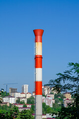 Fototapeta na wymiar White-red metal pipe of the boiler chimney