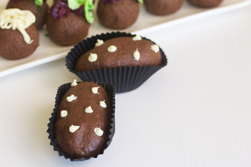 Homemade a brownie Potato. Decorated cakes with cream. Close-up shot.