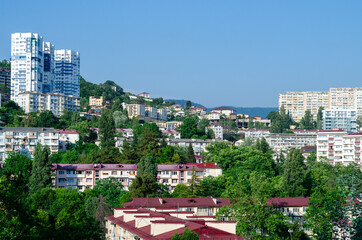 Apartment buildings in the hills. Landscape of a modern city