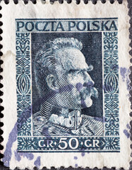 POLAND-CIRCA 1928 : A post stamp printed in Poland showing a portrait of Marshal Jozef Pilsudski - obrazy, fototapety, plakaty