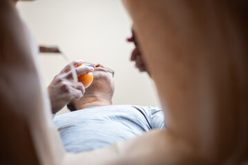 latin man opening box at home due to pandemic