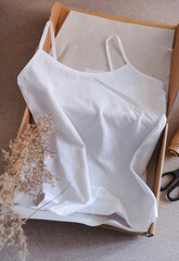 white top in a box  pampas grass, clothing, visual