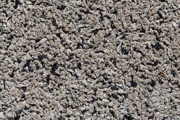 Crushed granite stones wall - close up