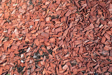 Brown wood chip mulch. Texture background. Horticulture and greenery