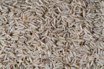 Close up of brown rice, texture background.