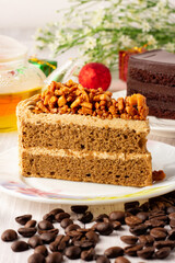 Almond Coffee Cake on a white plate, Triangular cake,Holiday celebration, Beautiful decoration in the cake cafe.