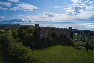 Aerial view of the historic part of Padenghe Castle on Lake Garda, Italy. Historic castles in Italy. Panorama of Lake Garda. Top view of the castle.