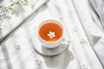 Colorful bright floral pattern with tea cup. Flat lay.