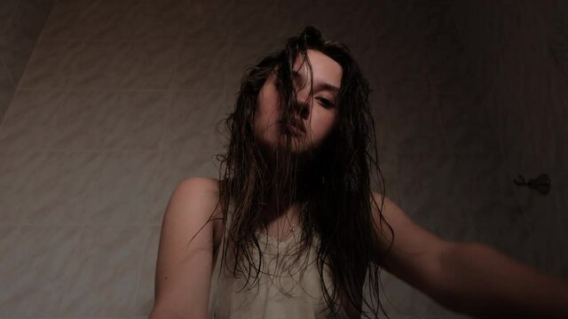 A girl suffering from a mental disorder. The girl shows aggression and panic in behavior.