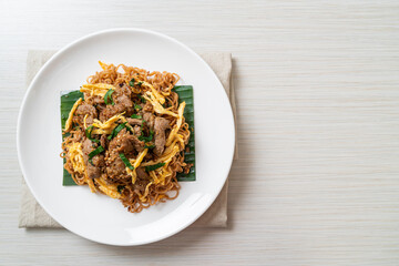 stir-fried instant noodle with pork and egg