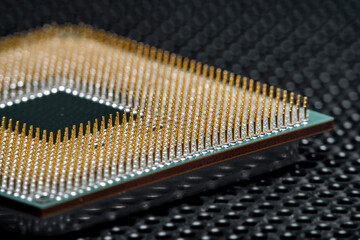 Close-up of a part of a microprocessor in soft focus under high magnification. Details of a computer component under a microscope.