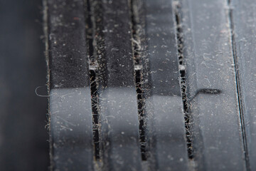 A background with an old plastic surface in soft focus at high magnification. Equipment surface covered with a thick layer of dust