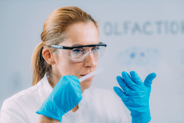 Olfaction. Female Scientists Examining Smells.