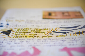 Bright colorful painted pages from a book or notebook. Selective focus.