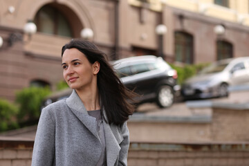 Portrait of brunette woman  in the street