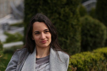 Portrait of brunette woman  in the street